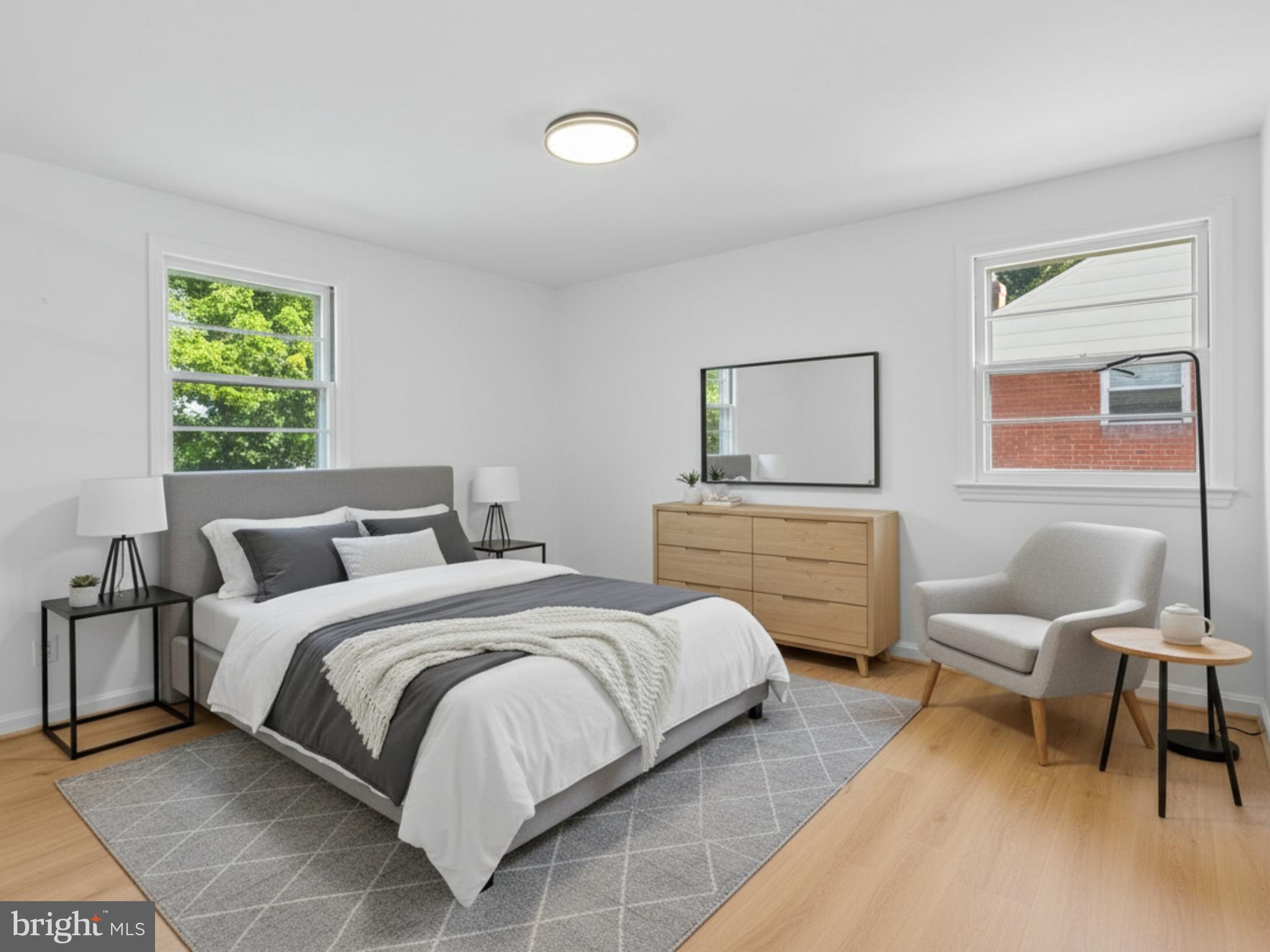 12907 Matey Road Silver Spring, MD 20906 - Photo 16 of 45 a bedroom with a bed and a couch