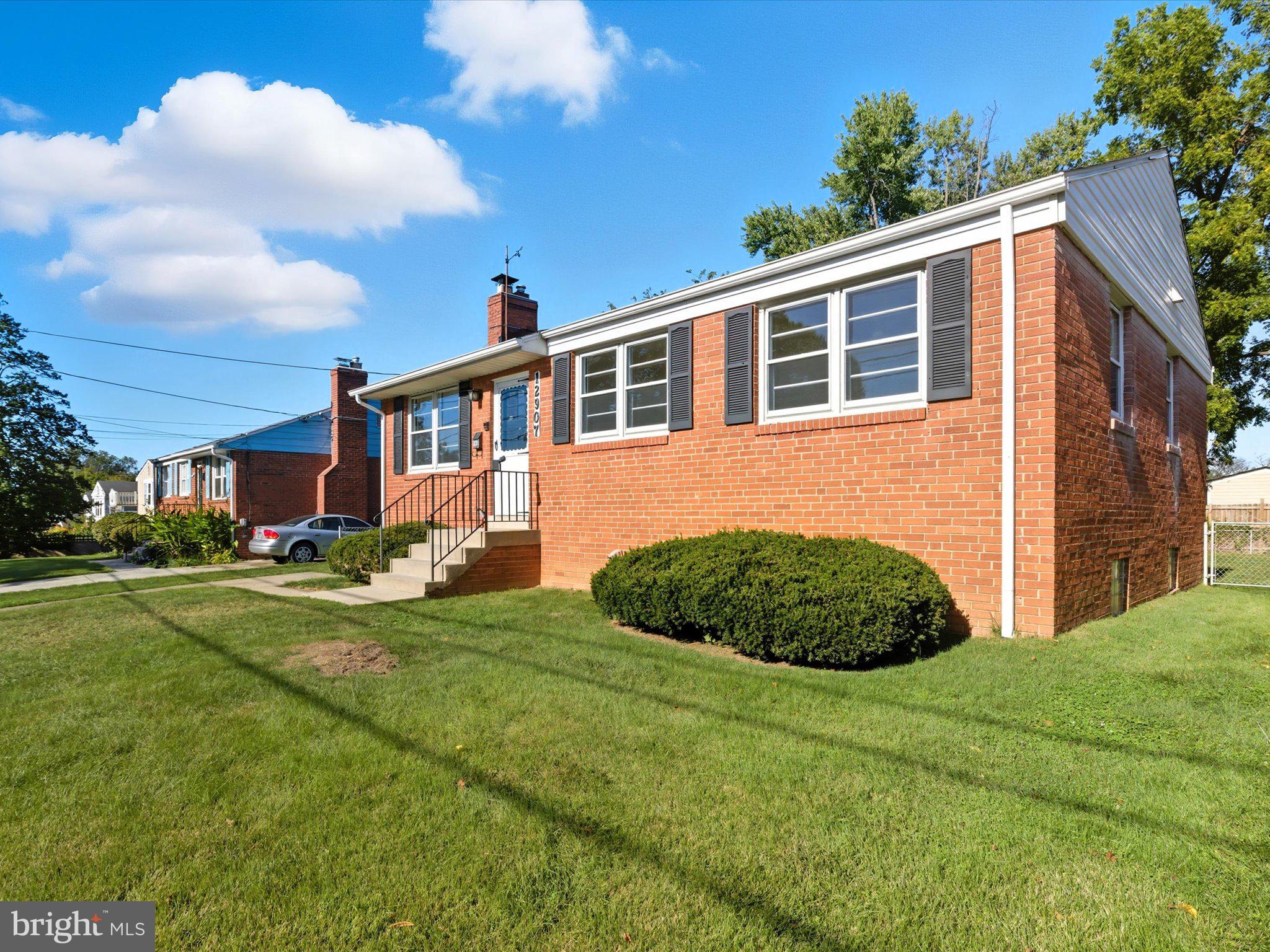 12907 Matey Road Silver Spring, MD 20906 - Photo 2 of 45 a front view of a house with garden