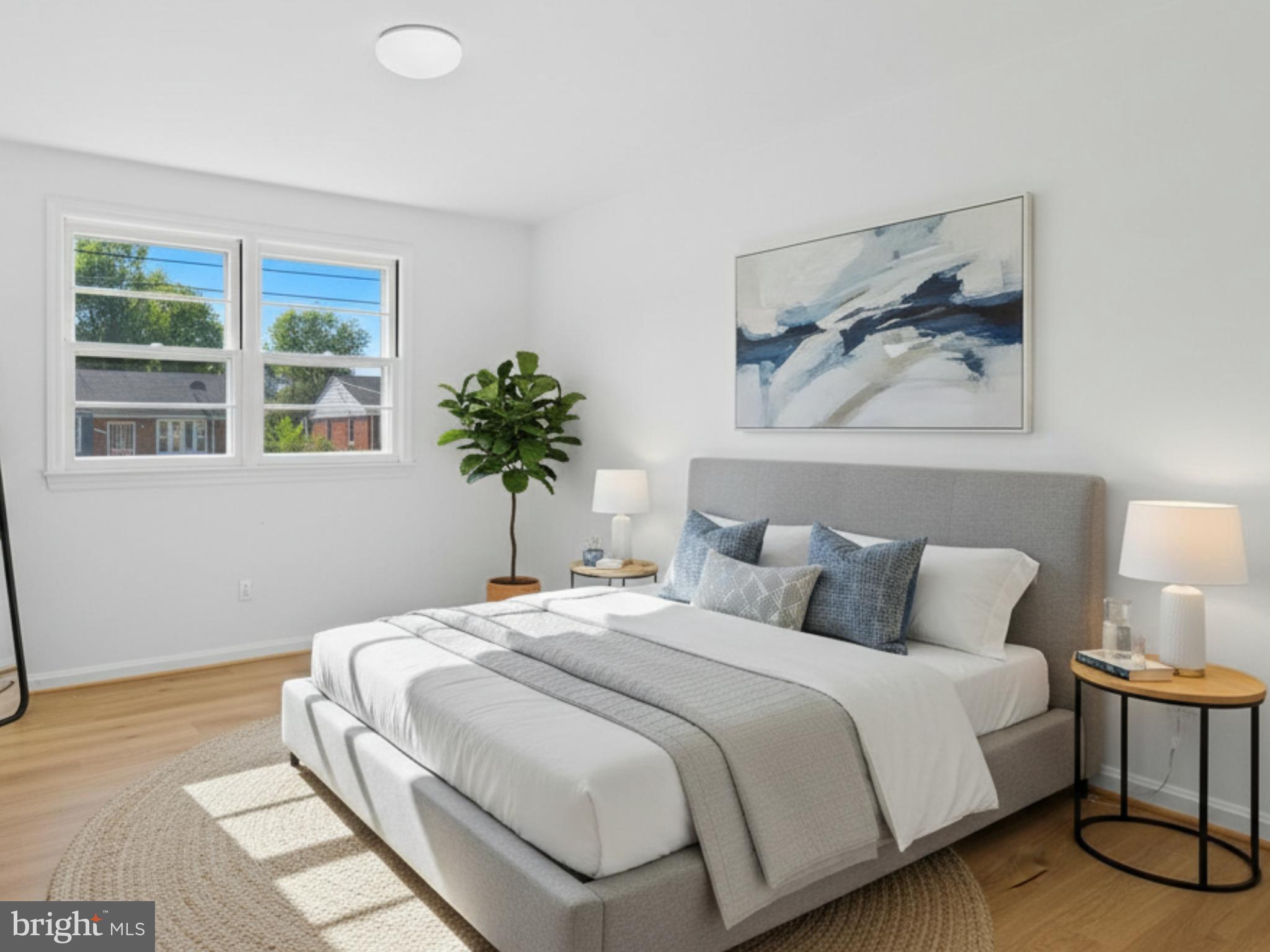 12907 Matey Road Silver Spring, MD 20906 - Photo 23 of 45 a bedroom with a bed and a painting on the wall