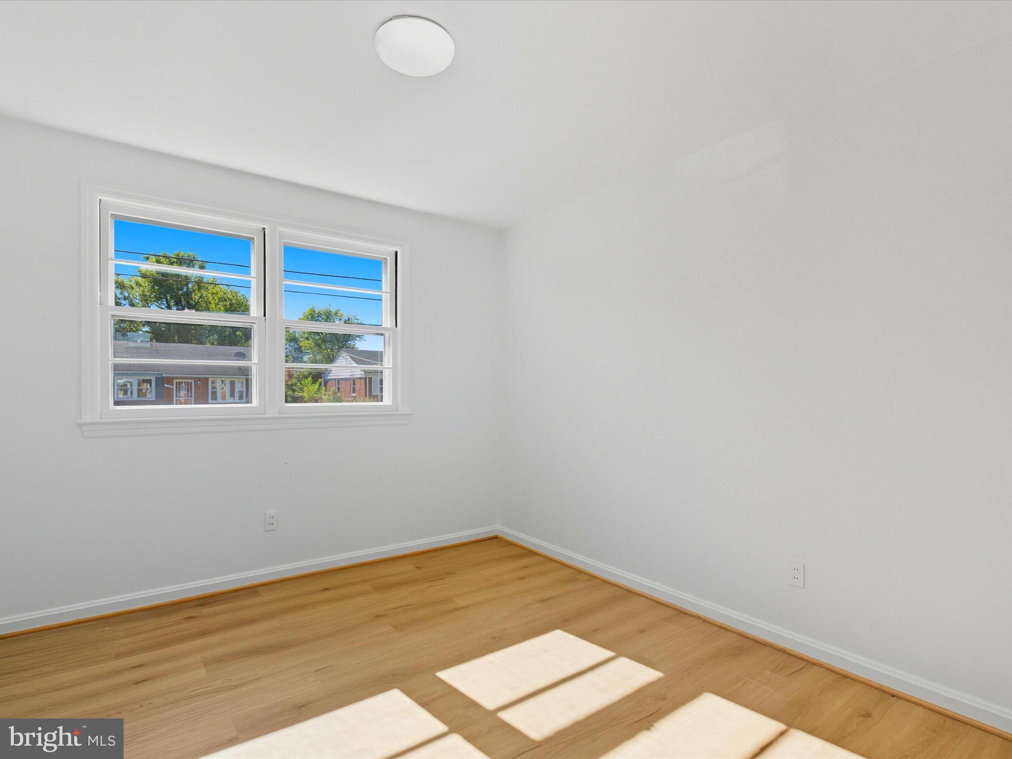 12907 Matey Road Silver Spring, MD 20906 - Photo 24 of 45 a view of a room with wooden floor and window