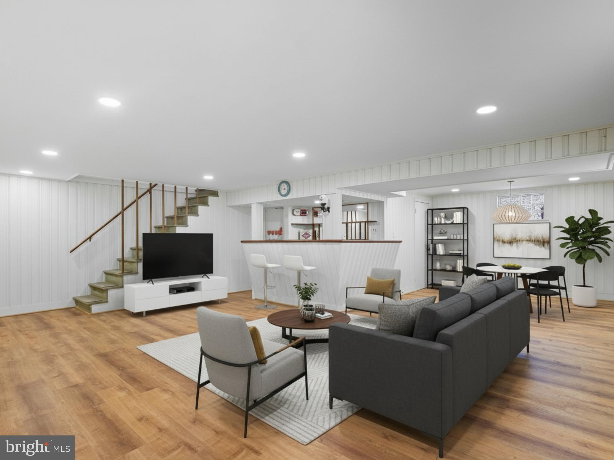 12907 Matey Road Silver Spring, MD 20906 - Photo 25 of 45 a living room with furniture and a flat screen tv