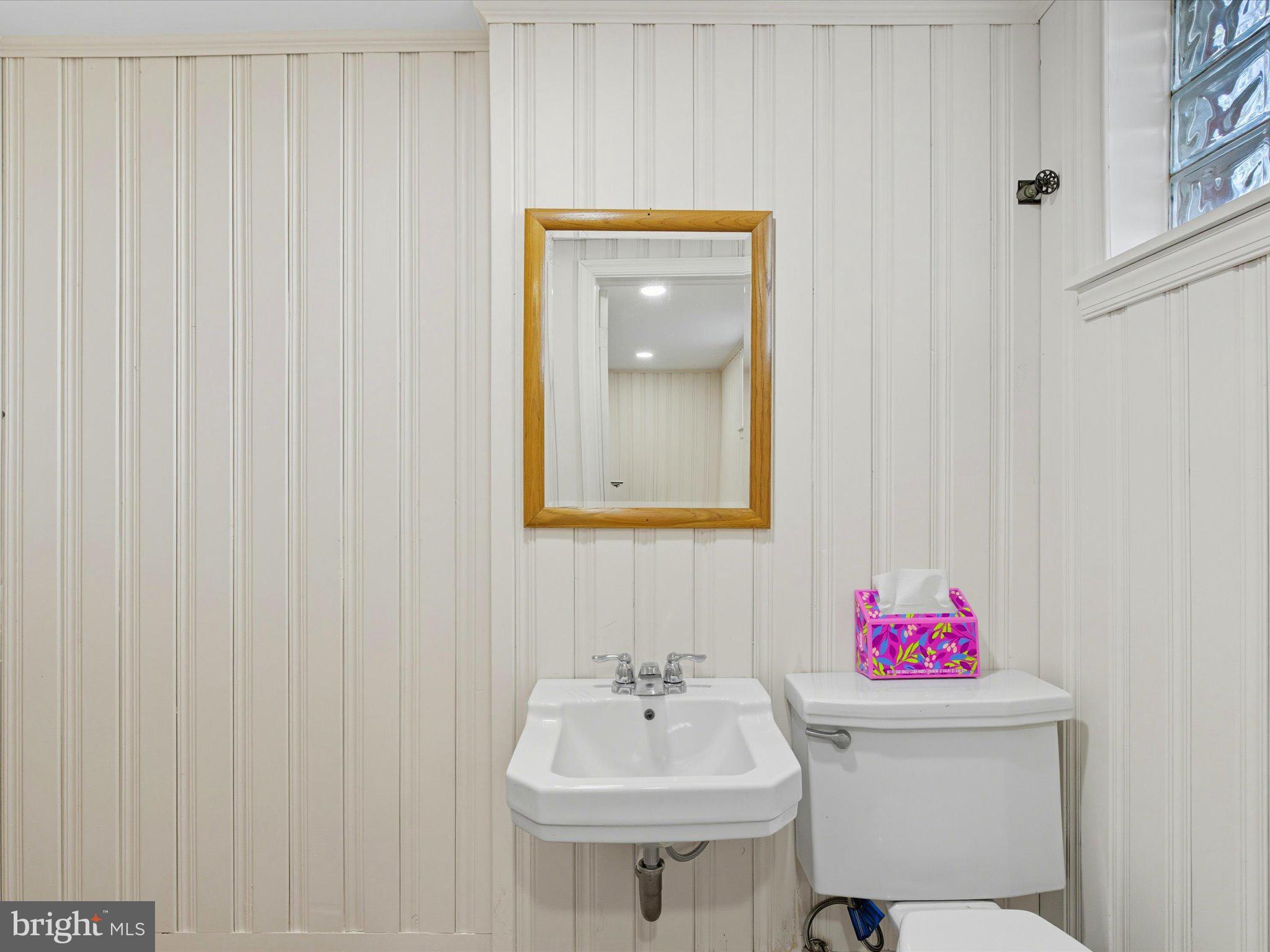12907 Matey Road Silver Spring, MD 20906 - Photo 28 of 45 a bathroom with a sink and a mirror