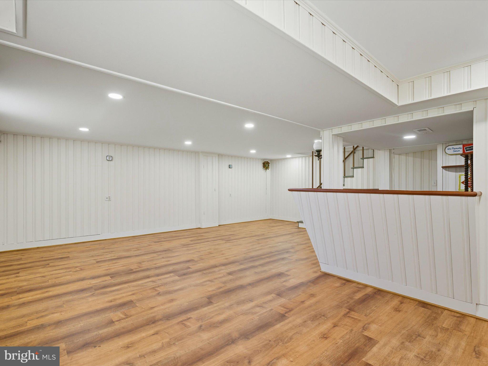 12907 Matey Road Silver Spring, MD 20906 - Photo 29 of 45 a view of an empty room with wooden floor