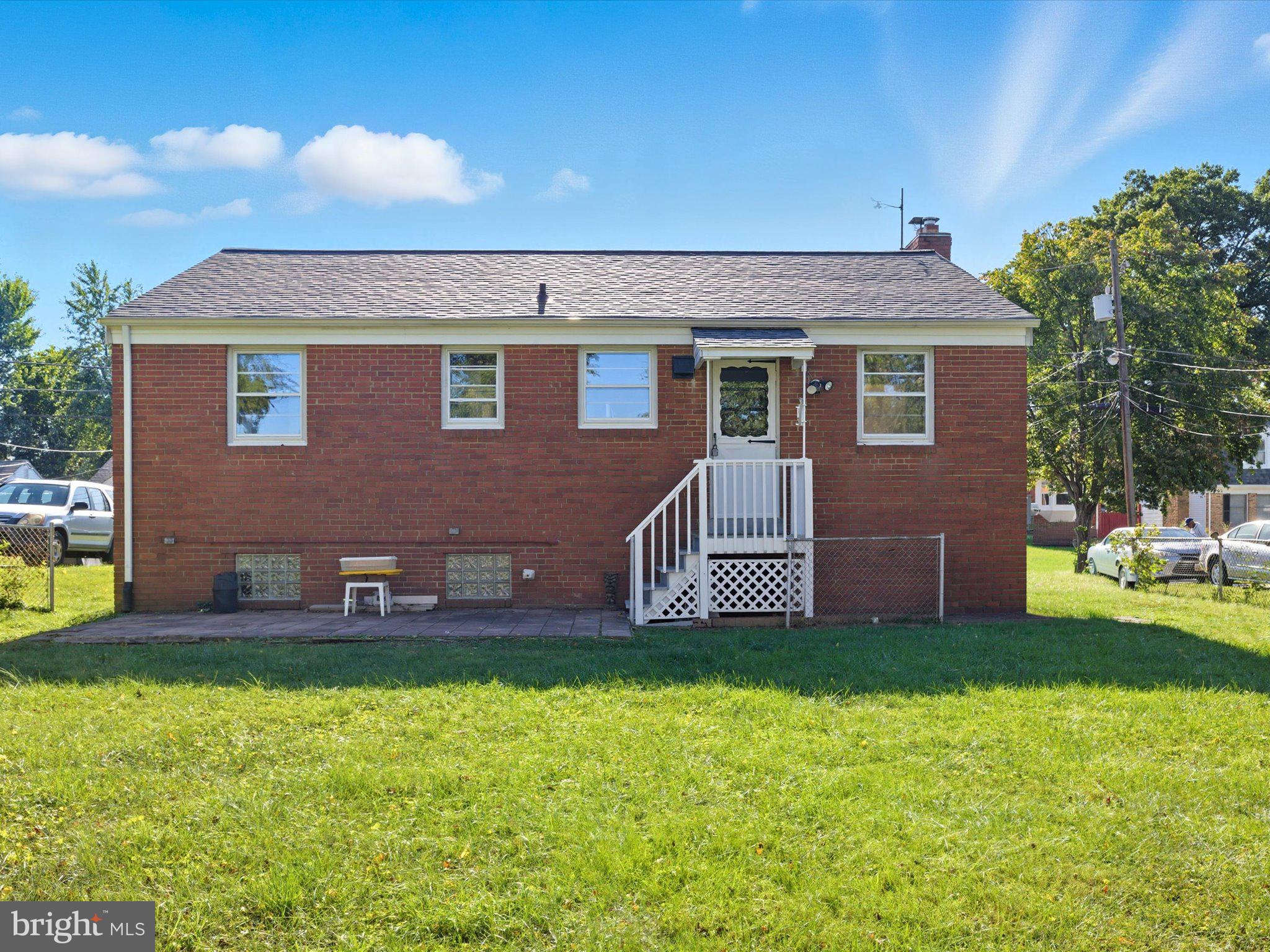 12907 Matey Road Silver Spring, MD 20906 - Photo 33 of 45 a front view of a house with garden