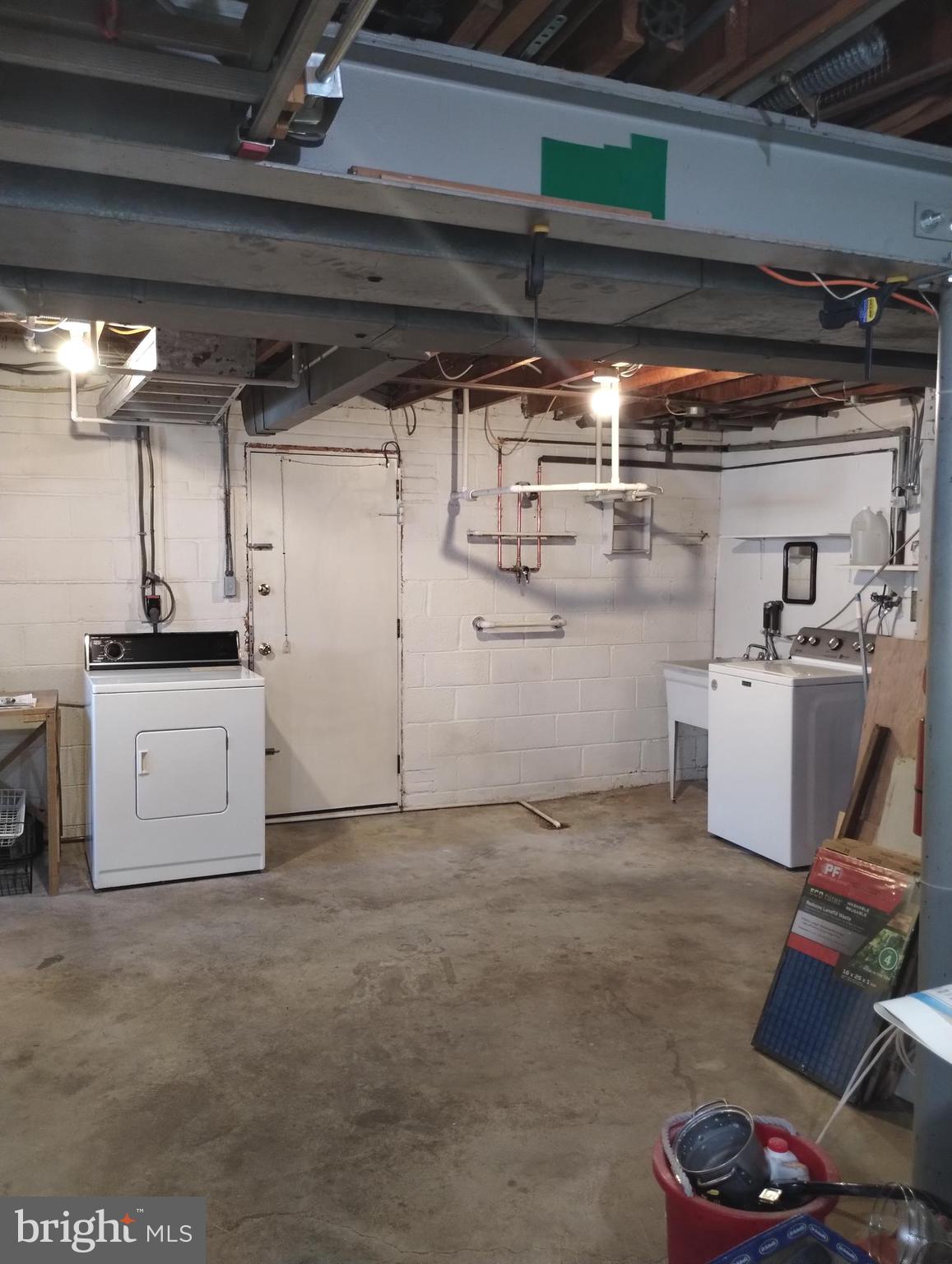 12907 Matey Road Silver Spring, MD 20906 - Photo 38 of 45 a utility room with cabinets dryer and washer