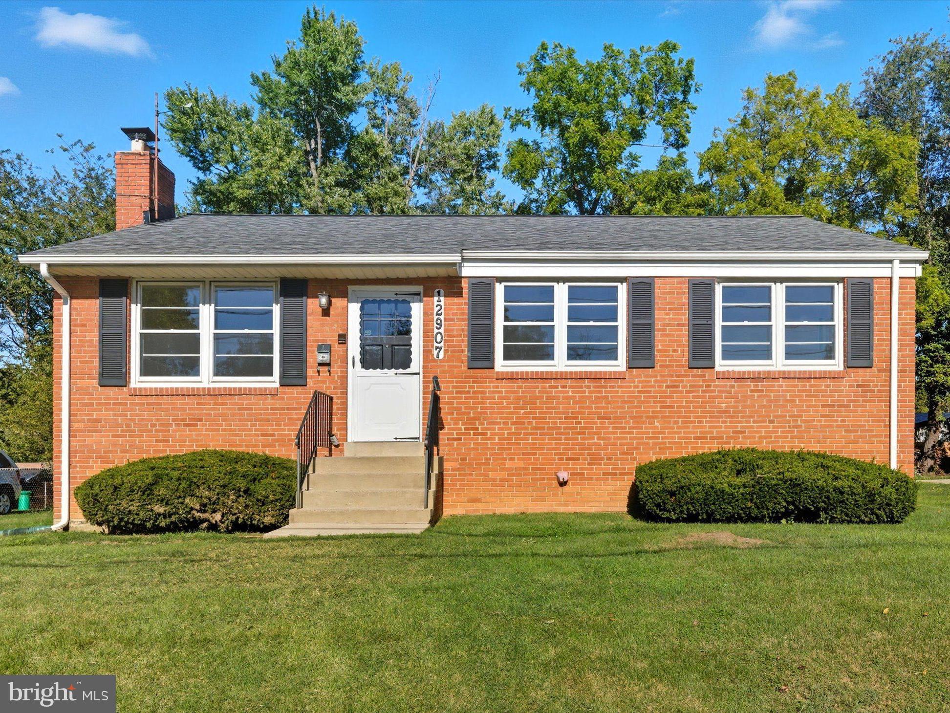 12907 Matey Road Silver Spring, MD 20906 - Photo 42 of 45 a house with trees in the background
