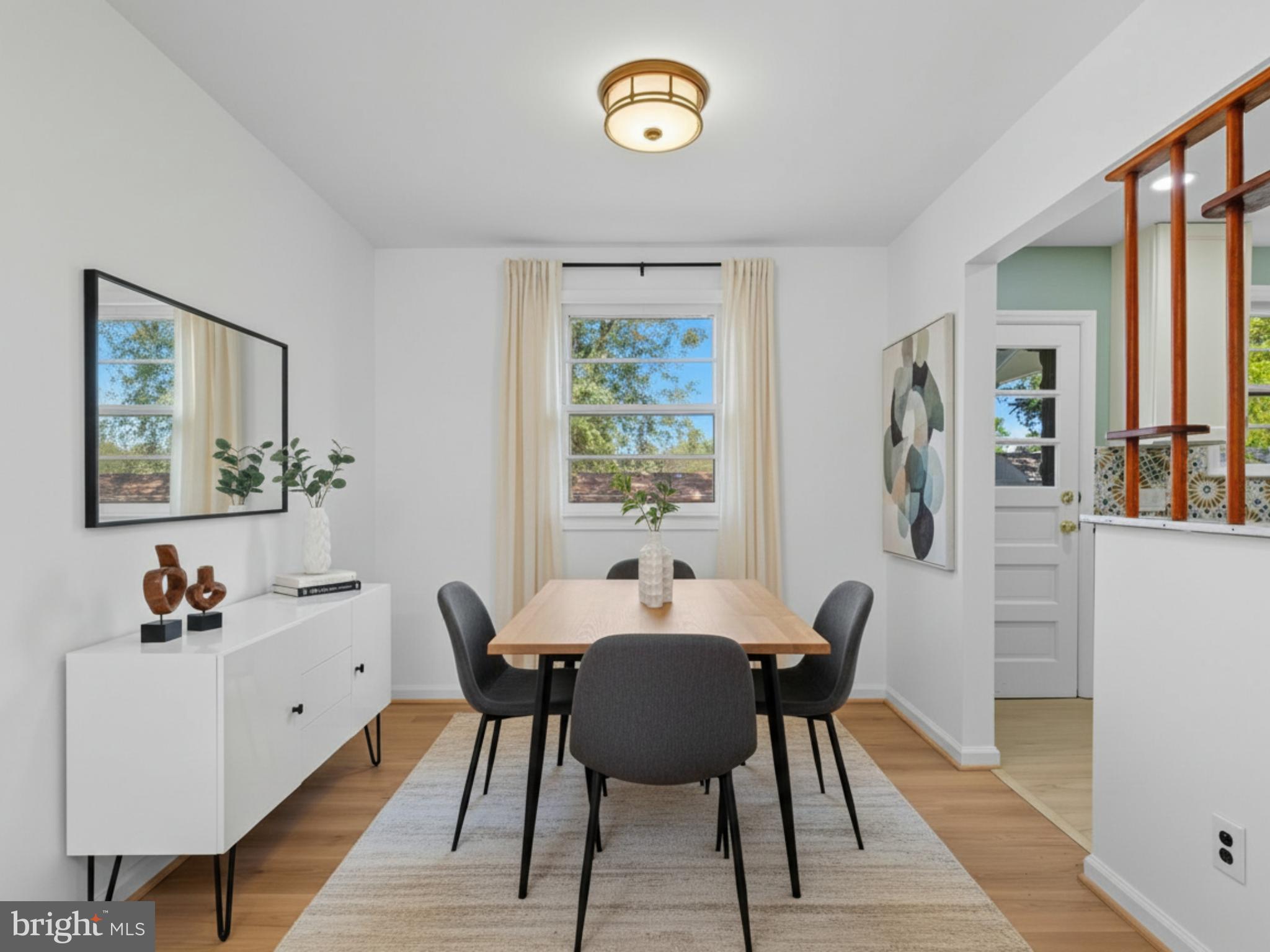 12907 Matey Road Silver Spring, MD 20906 - Photo 8 of 45 a view of a dining room with furniture window and wooden floor