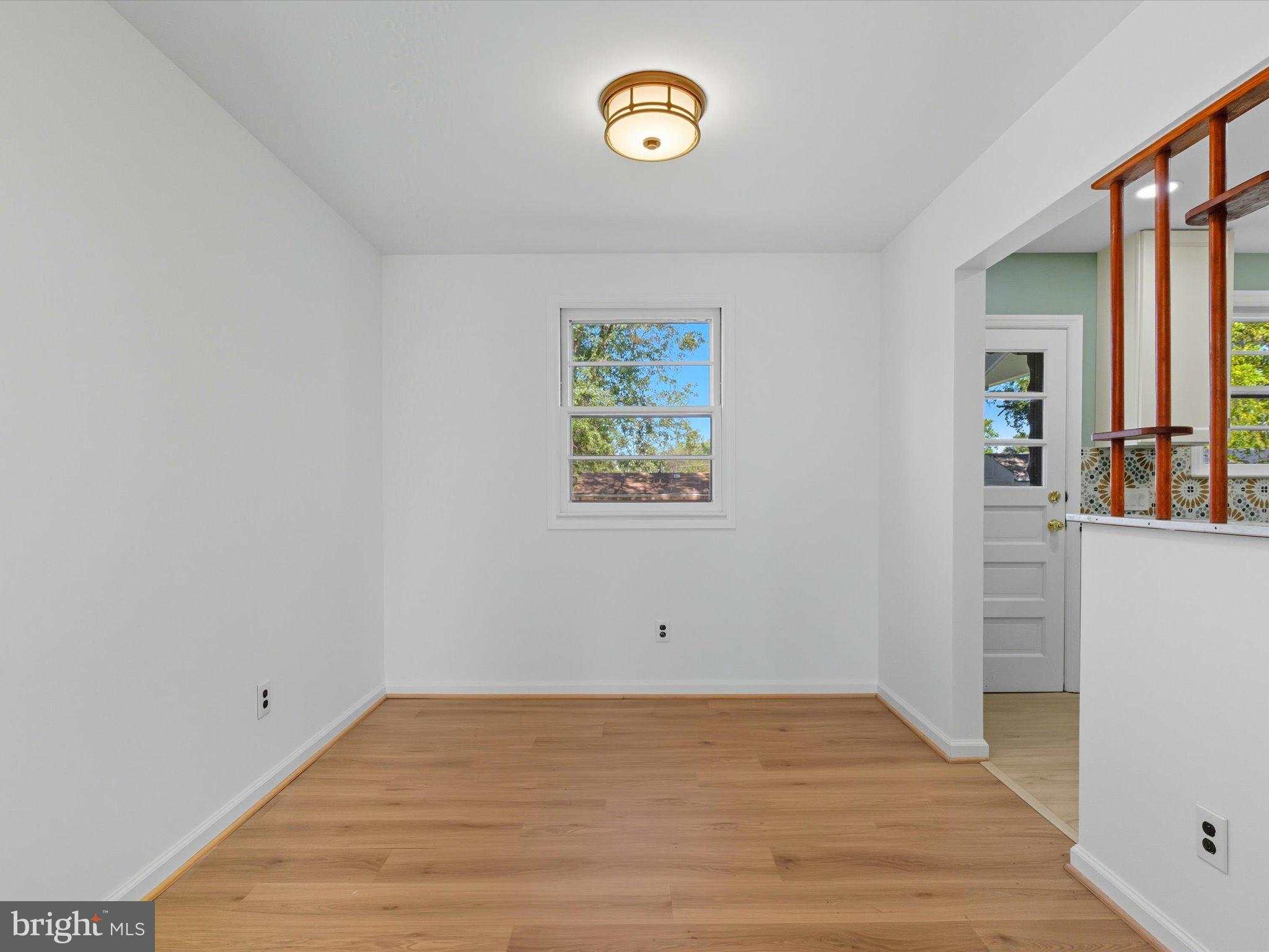 12907 Matey Road Silver Spring, MD 20906 - Photo 9 of 45 a view of a room with wooden floor and window