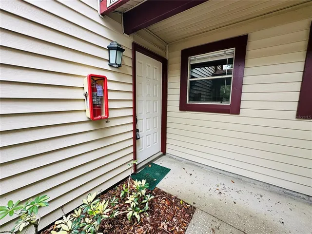a view of a house with a door and a window