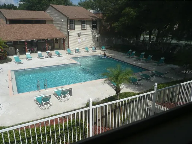 a view of a patio and backyard
