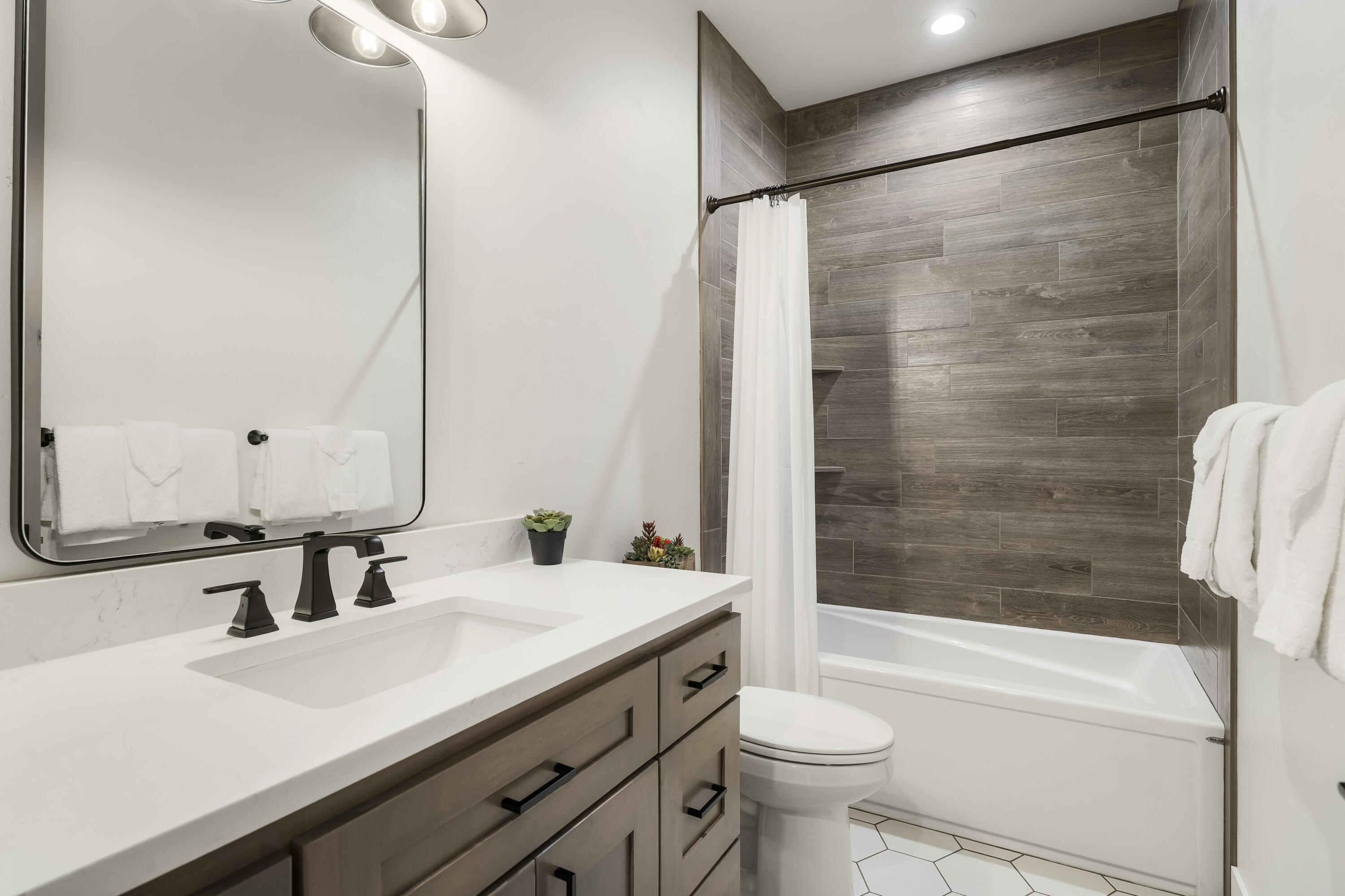 56302 Sable Rock Loop, Unit 255 Bend, OR 97707 - Photo 41 of 65 a bathroom with a sink and a mirror