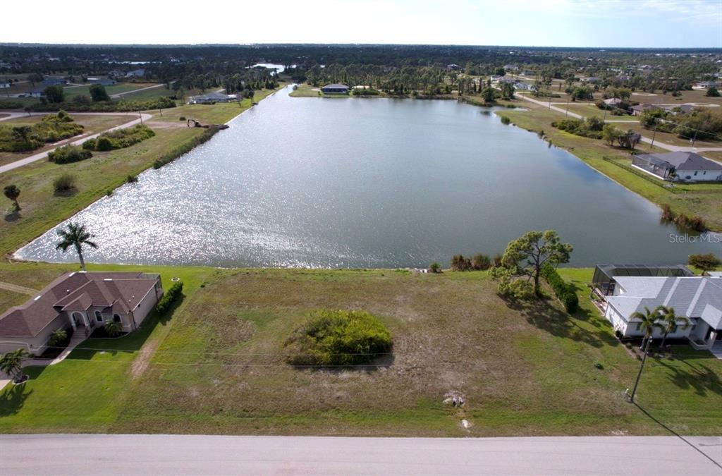 a view of a lake with a yard