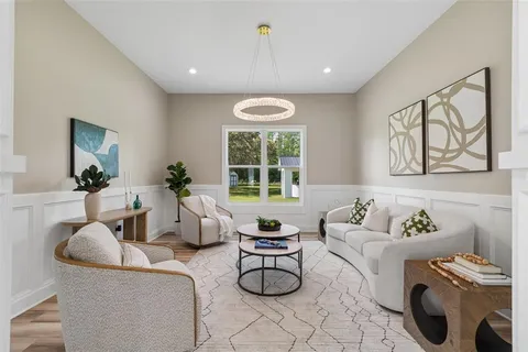 a kitchen with stainless steel appliances a sink a stove and cabinets