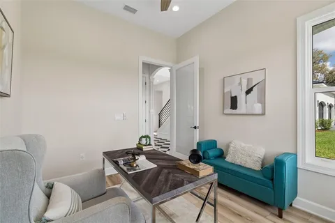 a view of a dining room with furniture window and outside view