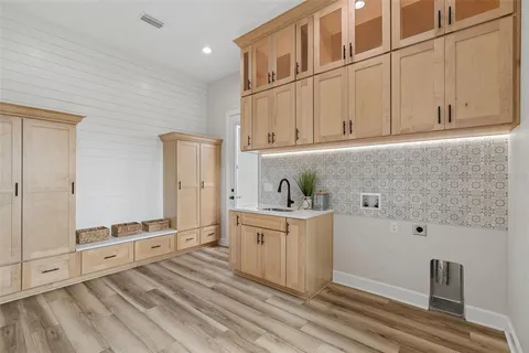 a bed room with a bed and a chandelier