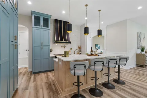 a bathroom with double vanity sink and a mirror