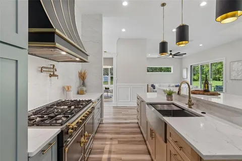 a bathroom with a tub a mirror and a shower