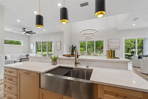 a front view of a house with yard and green space