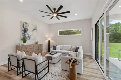 a view of an outdoor dining space with a table and chairs