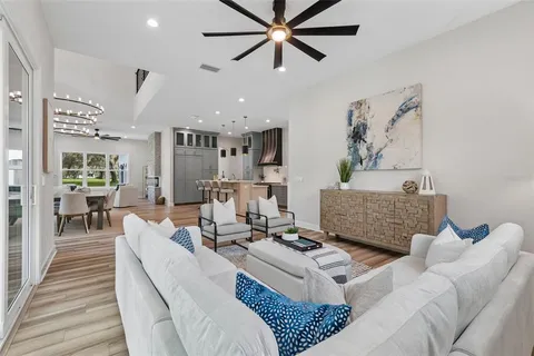 a front view of a house with a garden and yard