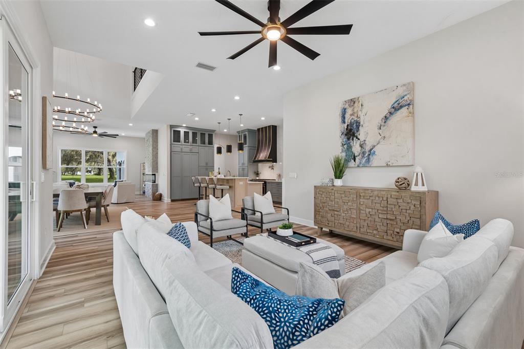 13711 Lussier Lane Spring Hill, FL 34610 - Photo 38 of 88 a living room with furniture and a wooden floor