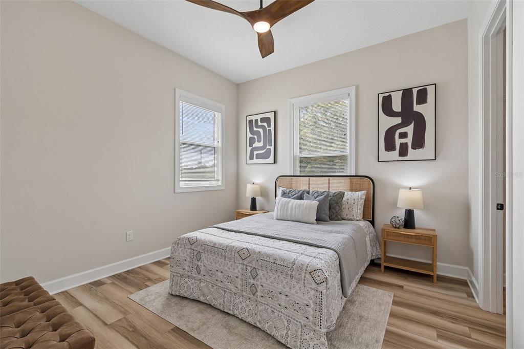 13711 Lussier Lane Spring Hill, FL 34610 - Photo 49 of 88 a bedroom with a large bed and a window