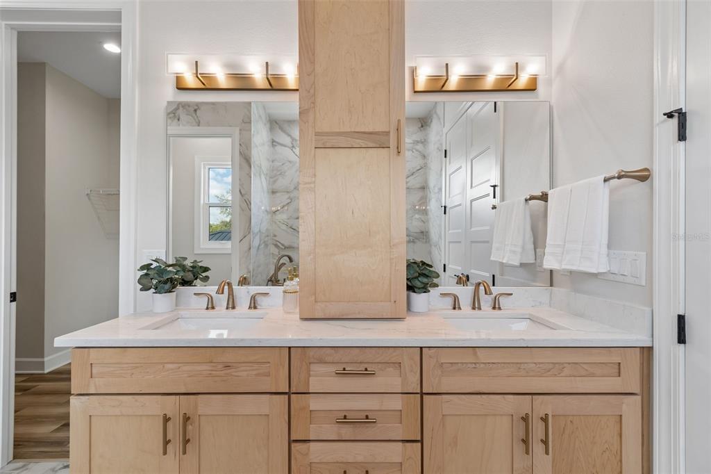 13711 Lussier Lane Spring Hill, FL 34610 - Photo 61 of 88 a bathroom with double vanity sink and a mirror