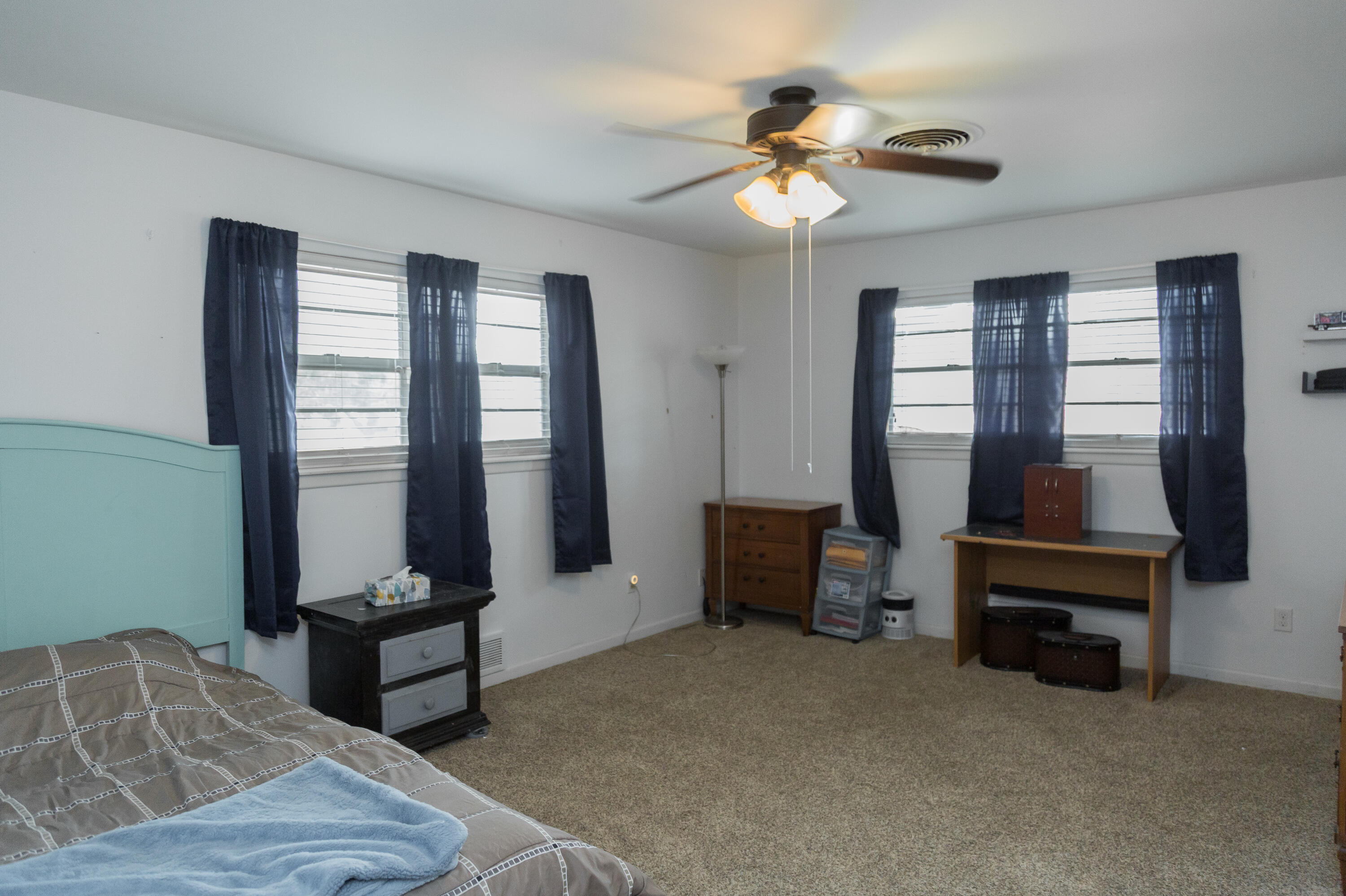 904 Itasca Street Plainview, TX 79072 - Photo 25 of 53 a bedroom with furniture and a window