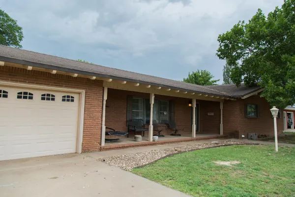 a view of house with backyard porch and entertaining space