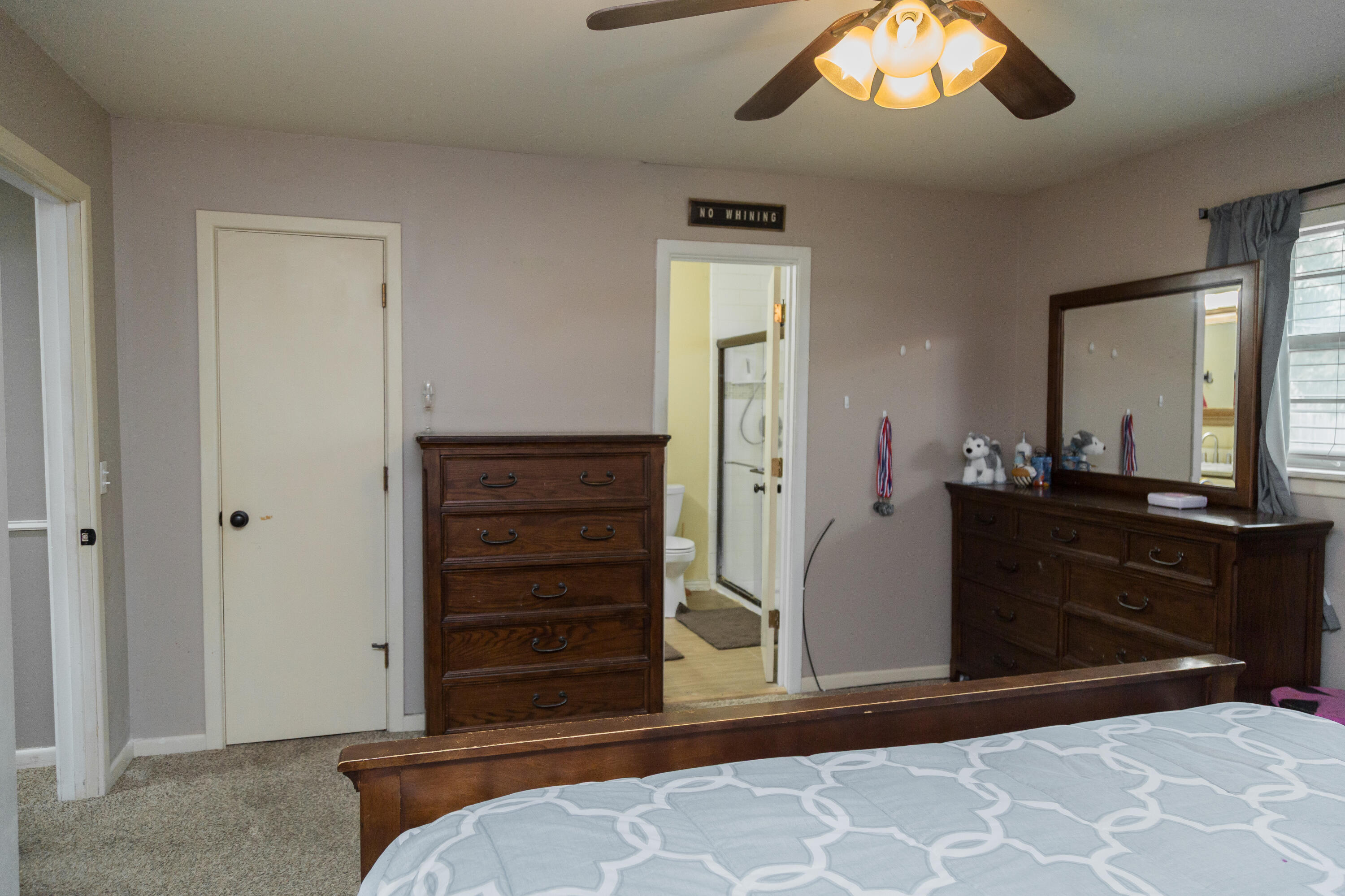 904 Itasca Street Plainview, TX 79072 - Photo 34 of 53 a bedroom with a bed and a dresser