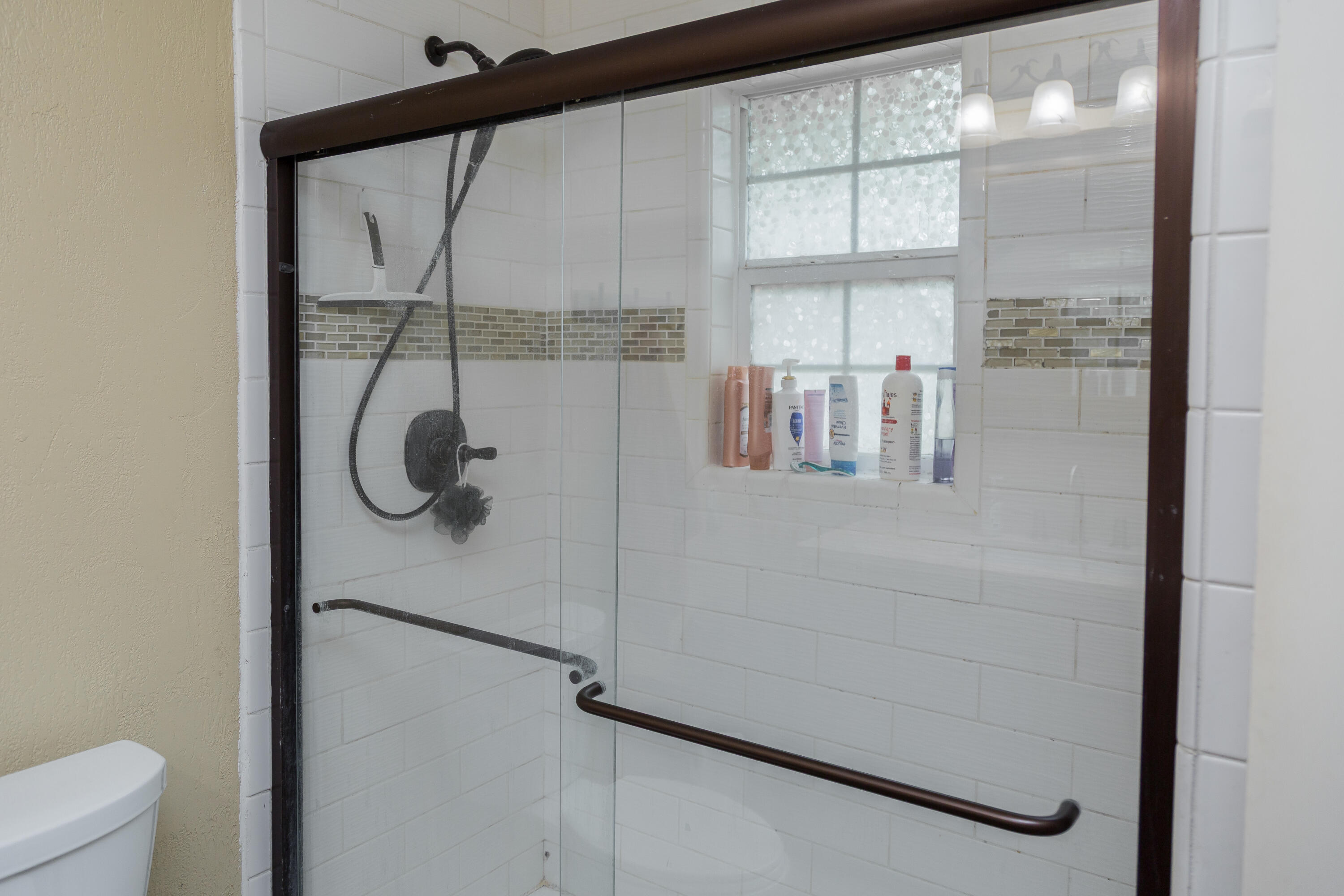 904 Itasca Street Plainview, TX 79072 - Photo 37 of 53 a bathroom with a shower