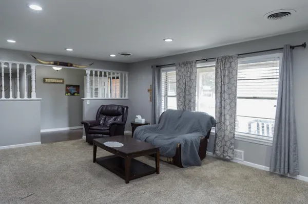 a living room with furniture and a window
