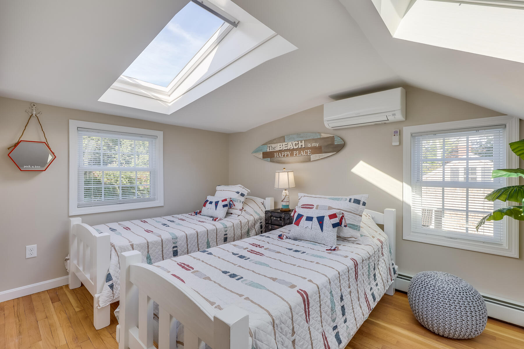 547 Shootflying Hill Road Centerville, MA 02632 - Photo 32 of 38 a bedroom with two beds and wooden floor