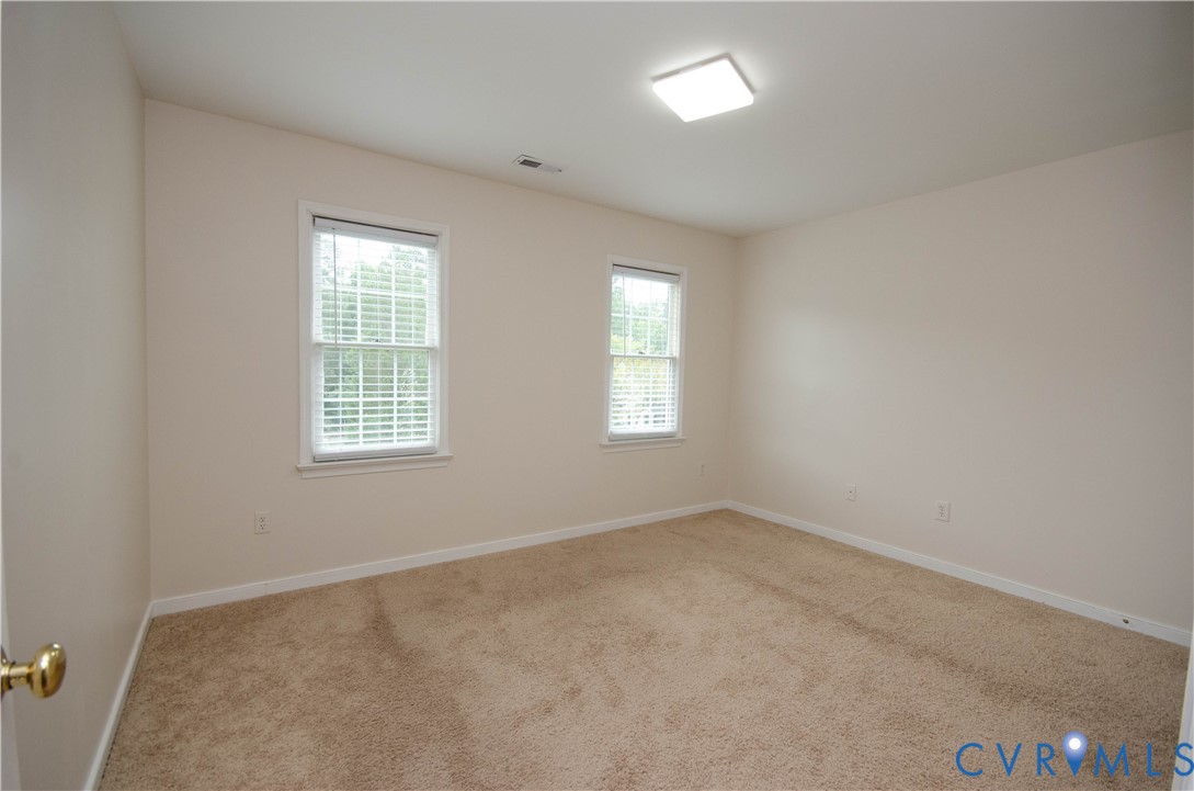 10912 Point Grey Road Henrico, VA 23233 - Photo 26 of 36 Neutral wall tones, two windows with blinds, reces