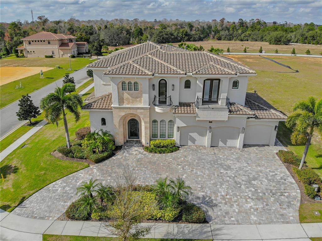 8033 Twin Eagles Loop Reunion, FL 34747 - Photo 14 of 42 an aerial view of a house with a garden