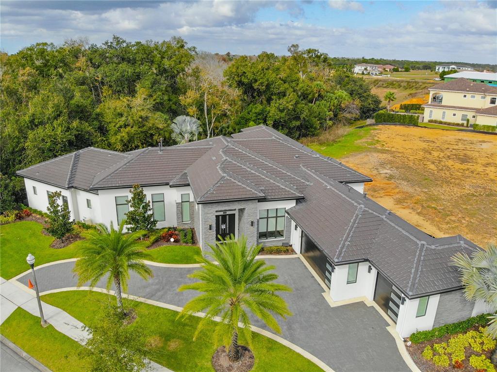 8033 Twin Eagles Loop Reunion, FL 34747 - Photo 16 of 42 an aerial view of residential houses with outdoor space and seating area