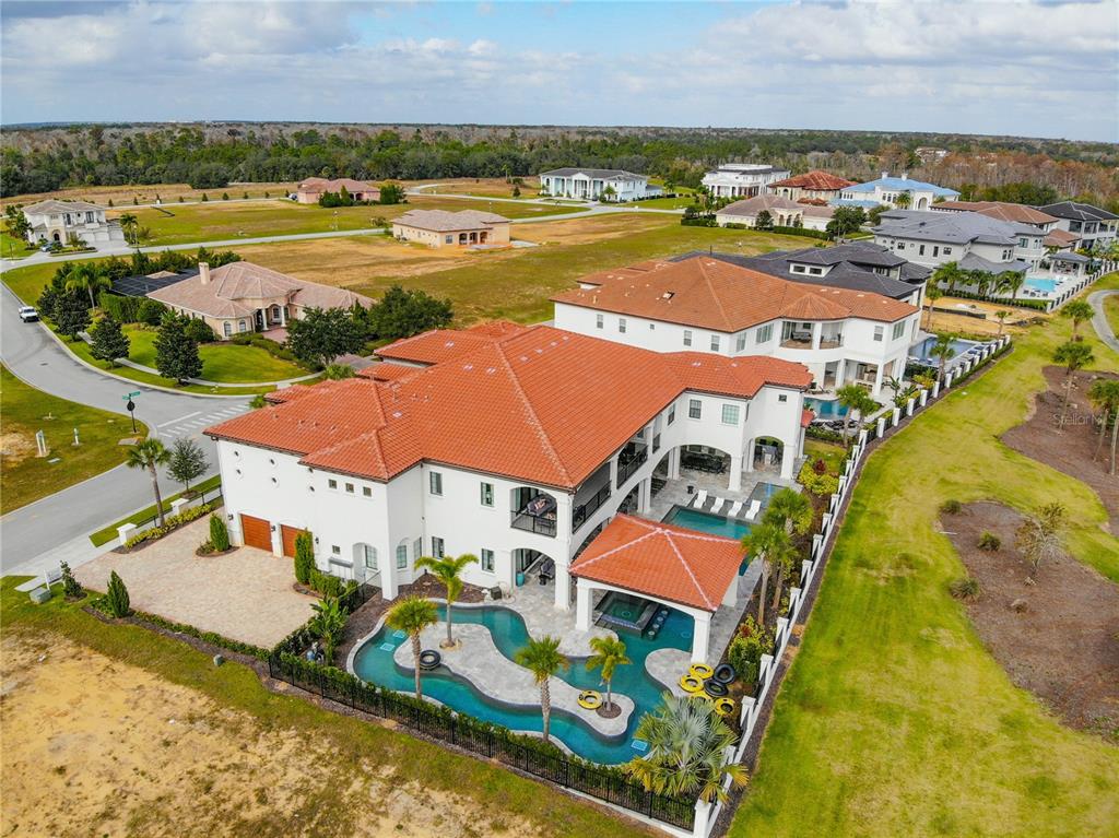 8033 Twin Eagles Loop Reunion, FL 34747 - Photo 17 of 42 an aerial view of residential houses with outdoor space and ocean view