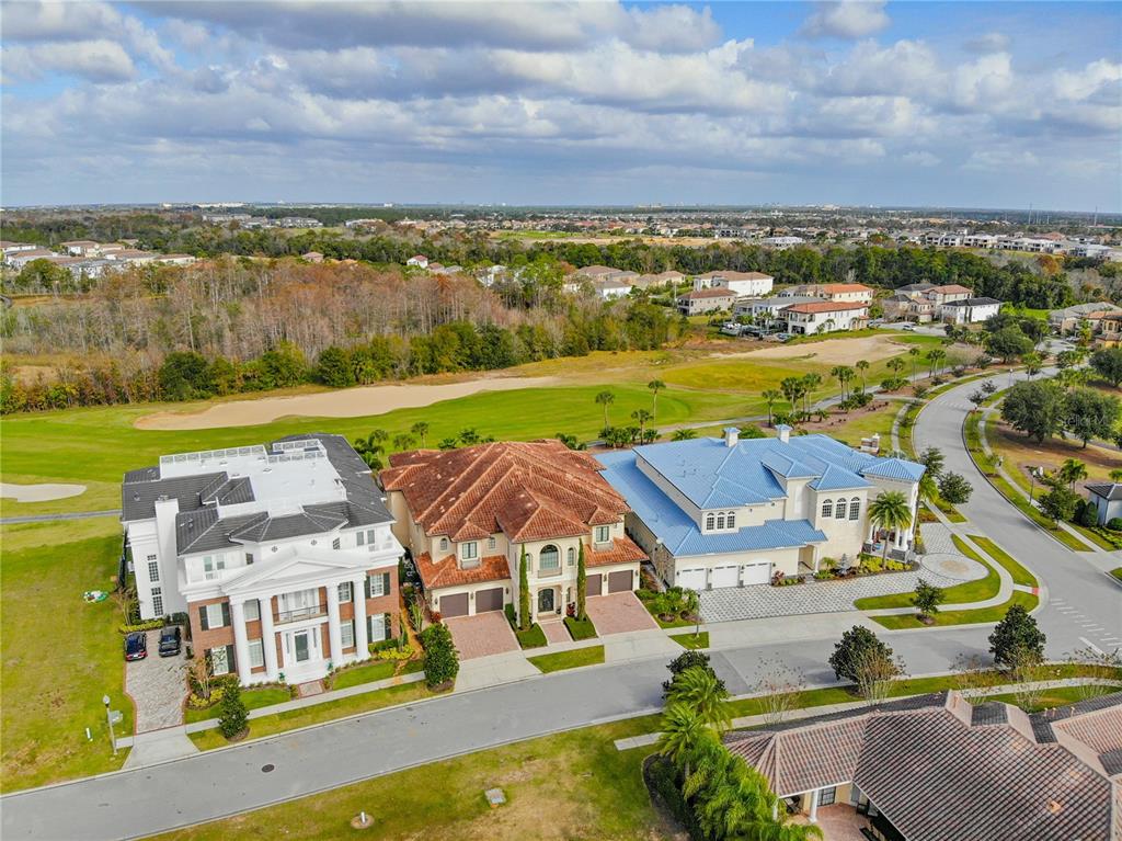 8033 Twin Eagles Loop Reunion, FL 34747 - Photo 18 of 42 an aerial view of residential houses with outdoor space and lake view