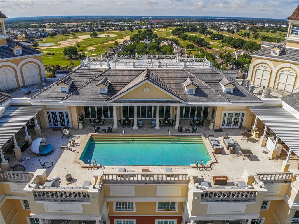 8033 Twin Eagles Loop Reunion, FL 34747 - Photo 24 of 42 swimming pool with outdoor seating and yard