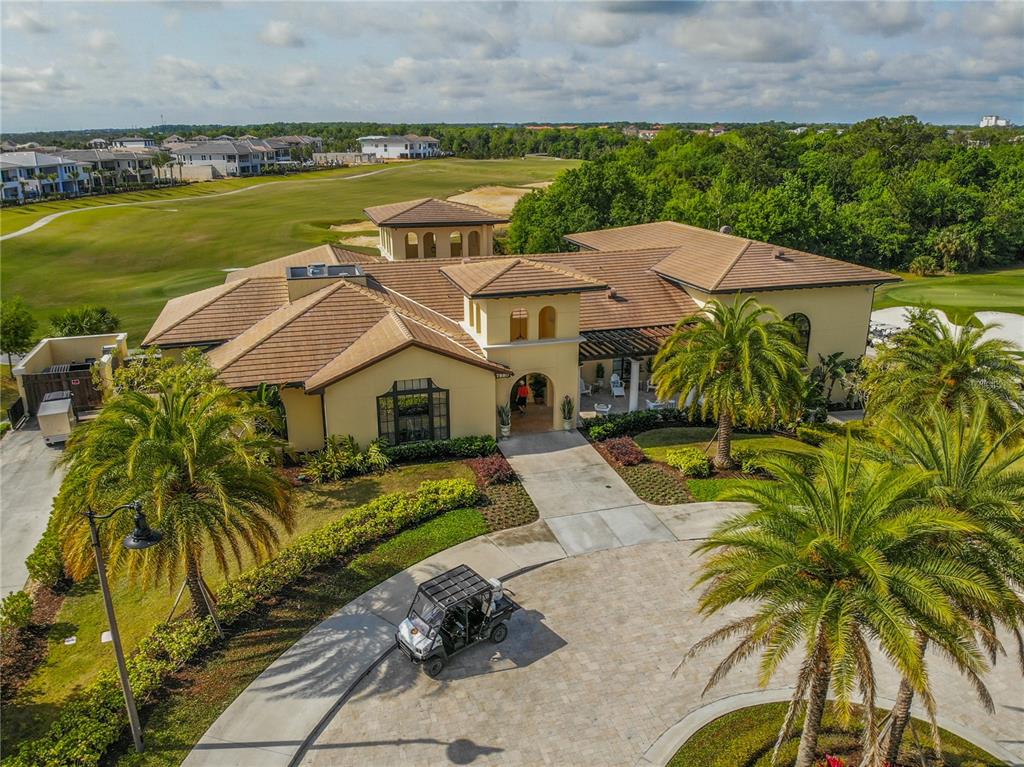 8033 Twin Eagles Loop Reunion, FL 34747 - Photo 25 of 42 an aerial view of a house with a garden and lake view