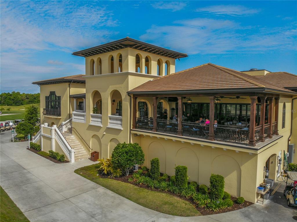 8033 Twin Eagles Loop Reunion, FL 34747 - Photo 26 of 42 a front view of a house with garden