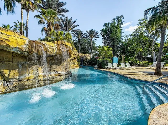 a view of a swimming pool with chairs