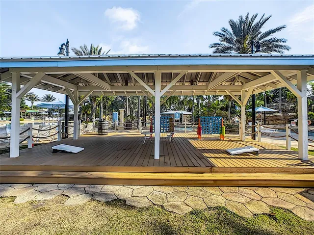 a swimming pool with outdoor seating and yard
