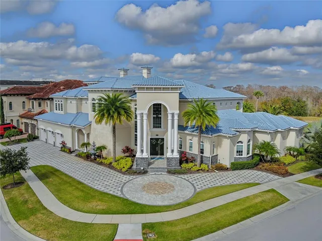 a view of a house with swimming pool and furniture