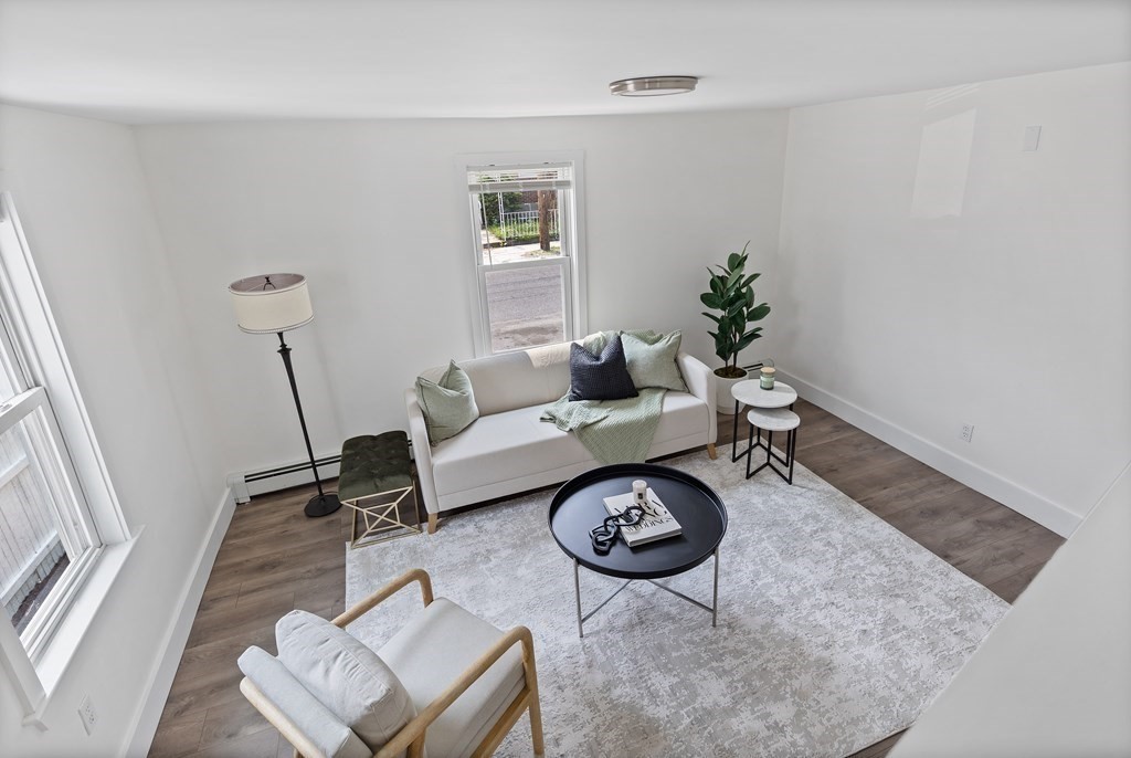 86 West Street Newton, MA 02458 - Photo 3 of 19 a living room with furniture a rug and a table