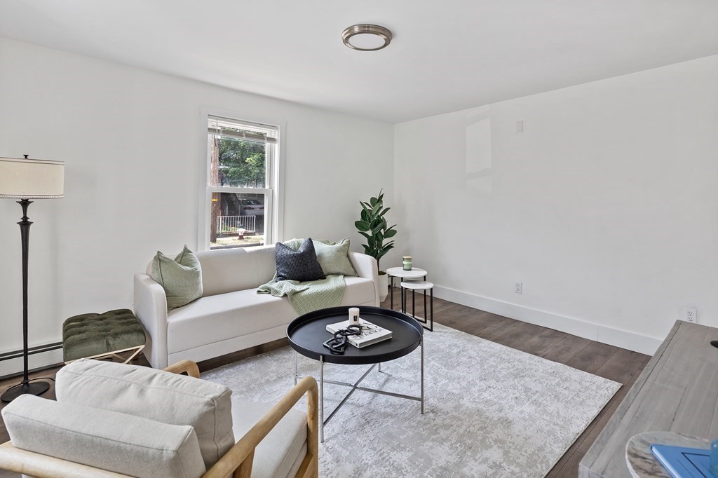 86 West Street Newton, MA 02458 - Photo 5 of 19 a living room with furniture a window and a table