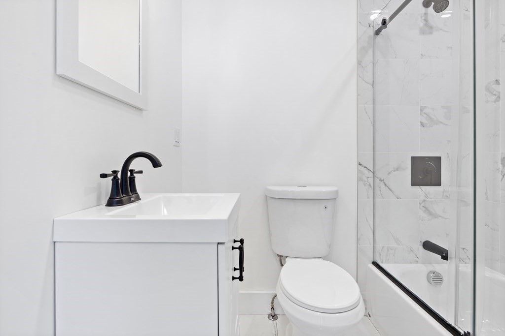 86 West Street Newton, MA 02458 - Photo 7 of 19 a bathroom with a sink toilet and shower