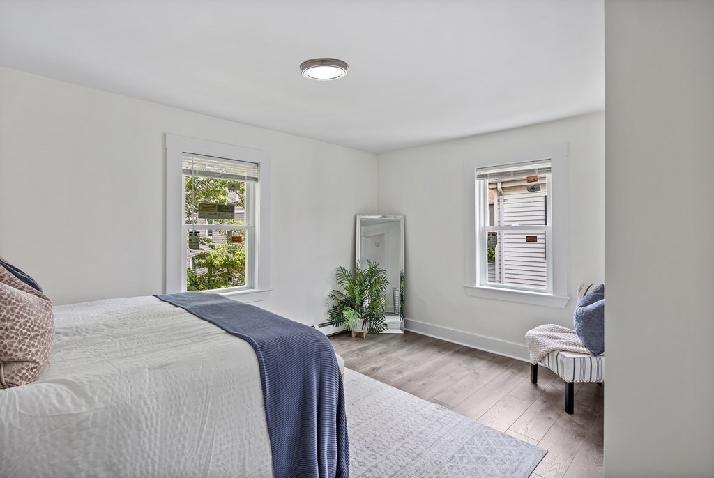 86 West Street Newton, MA 02458 - Photo 9 of 19 a spacious bedroom with a bed and a window