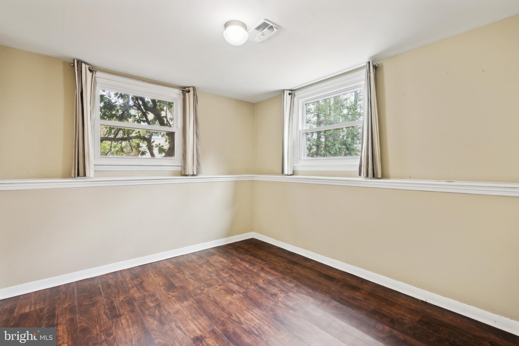 110 Sharrowvale Road Cherry Hill, NJ 08034 - Photo 15 of 25 wooden floor in an empty room with a window