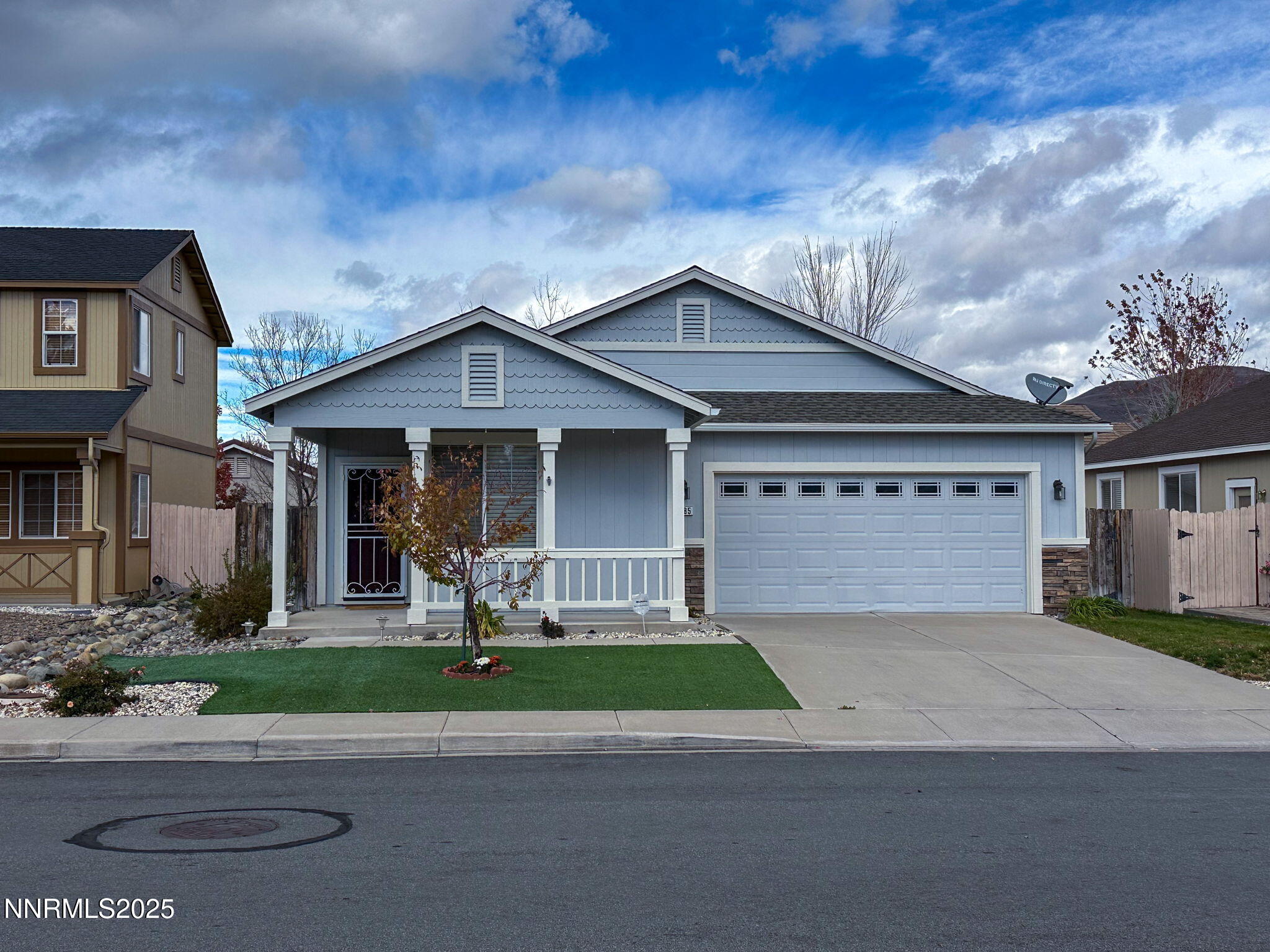 2185 Eagle Greens Drive Reno, NV 89521 - Photo 1 of 22 a front view of a house with a yard and garage